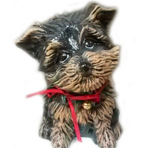 Sittande hund med rosett